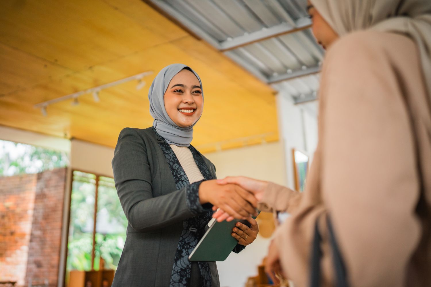 Young businesswoman shaking hands